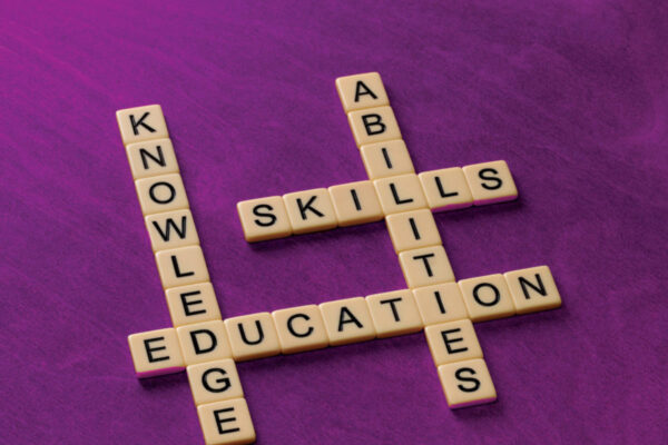 Cross-word tiles that spell Knowledge, Skills, Education, and Abilities.