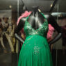 A photo of a green dress decorated with sequins.