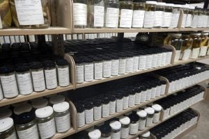 Specimen jars line several rows of shelves.