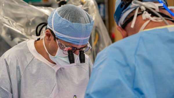 Dr. Carlos Mery operates on a patient