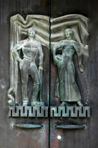 Doors showing a man and woman, sowing seeds and with farm tools
