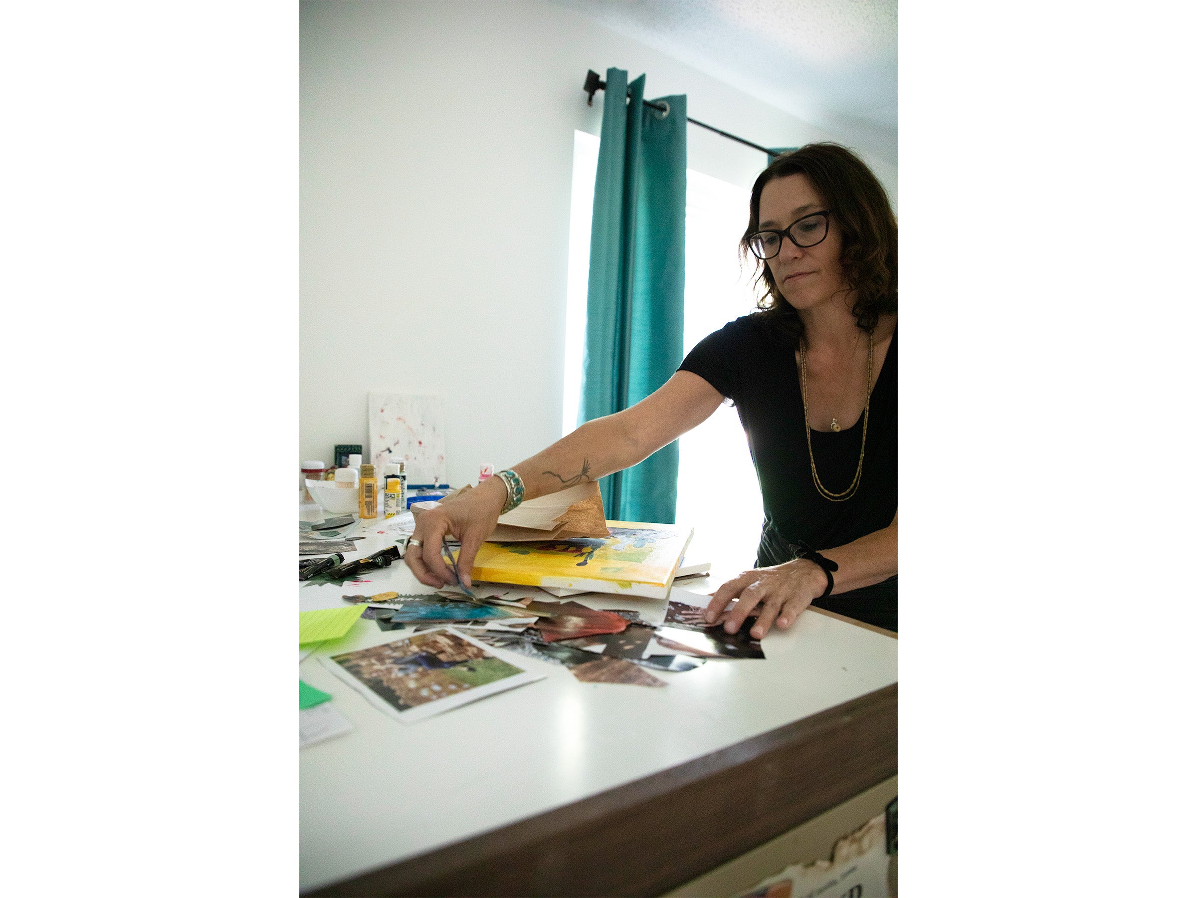 Laura Klopfenstein works on a table