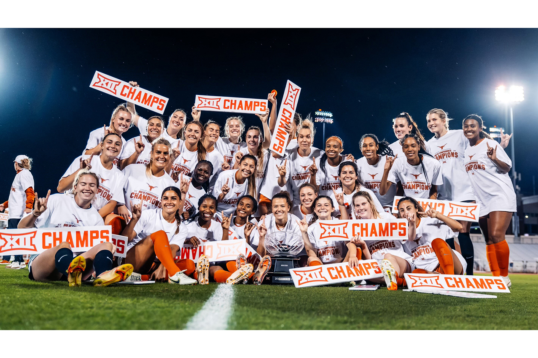 Texas soccer team holds up Big 12 champs signs in group photo