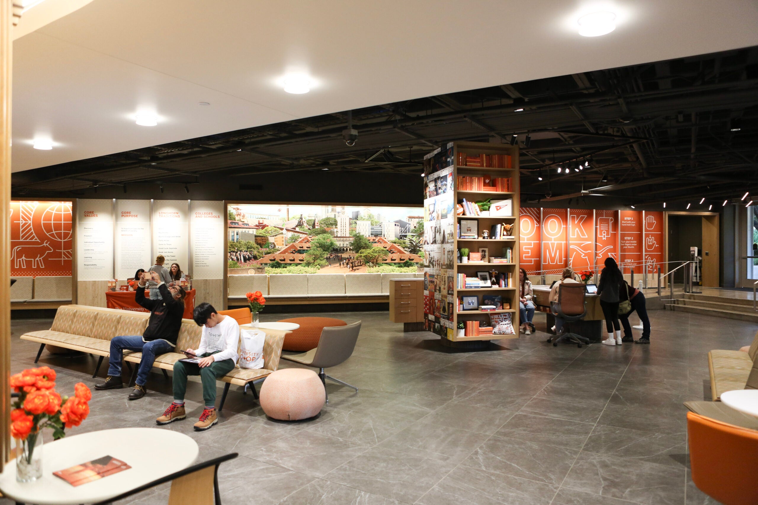 People wait and talk in the Admissions Welcome Center