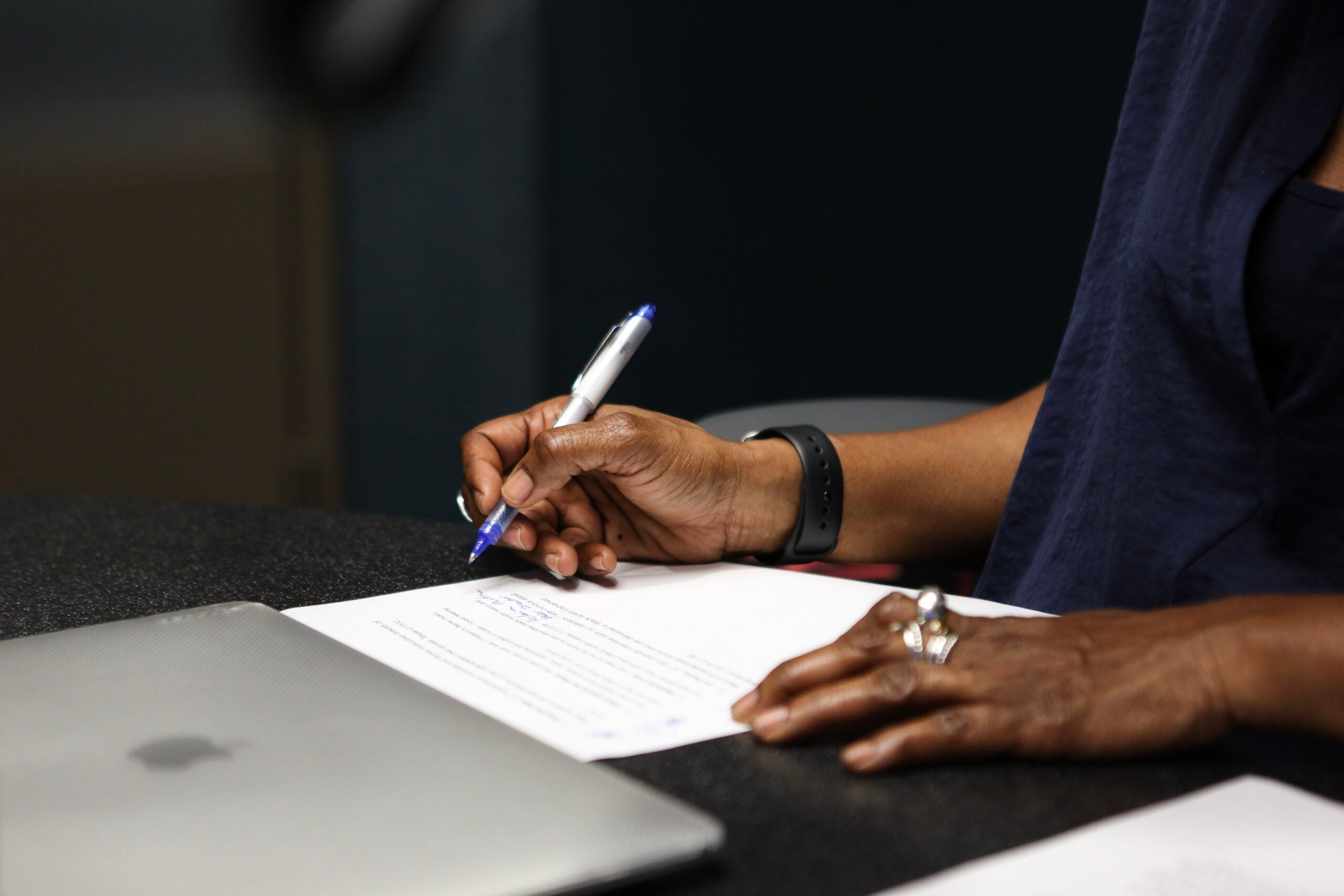 Close-up of person writing notes