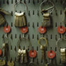 Rings of keys hanging from numbered hooks