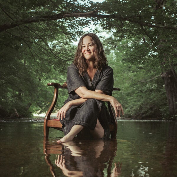 Photograph of lady sitting in water