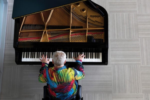 Overhead shot of man playing a grand piano