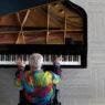 Overhead shot of man playing a grand piano
